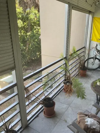 a view of a house with a backyard and a chair
