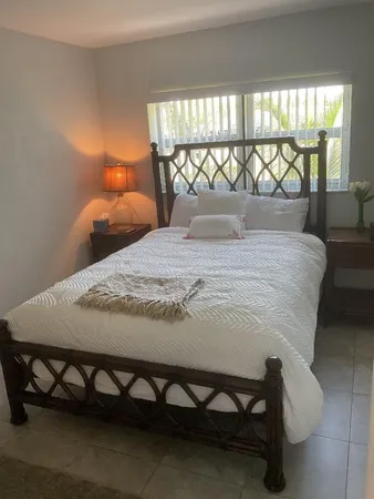 a bedroom with a bed and window