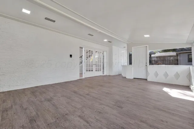 an empty room with windows