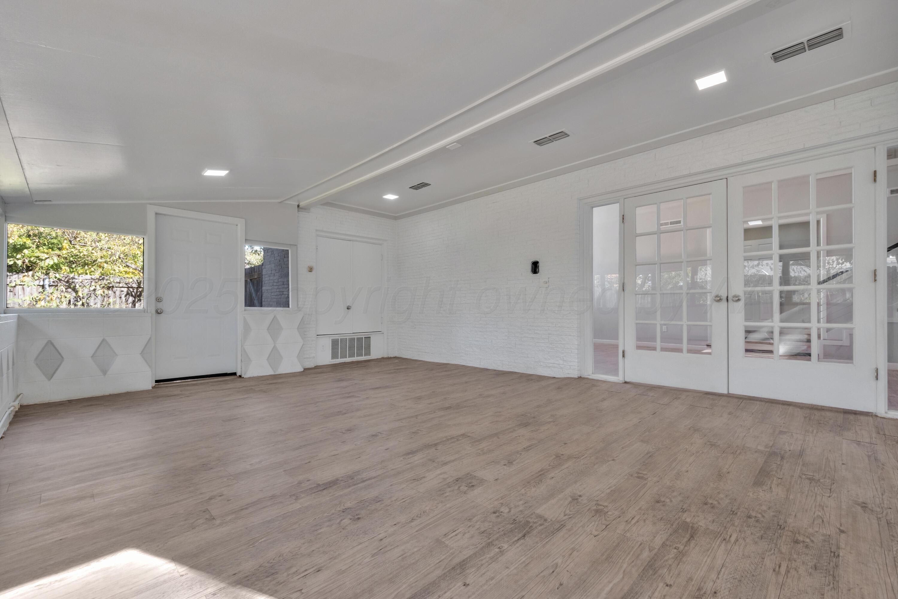 3700 Paramount Boulevard Amarillo, TX 79109 - Photo 17 of 40 an empty room with windows