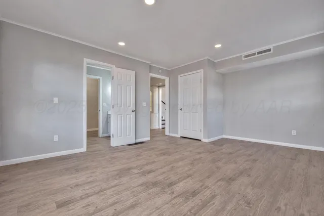 a bathroom with double vanity sink and a mirror