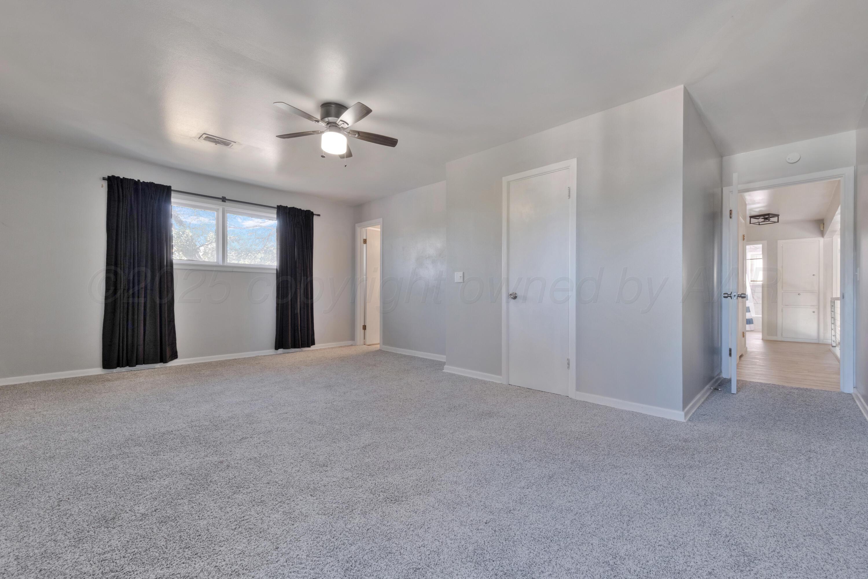 3700 Paramount Boulevard Amarillo, TX 79109 - Photo 22 of 40 a view of empty room with a ceiling fan