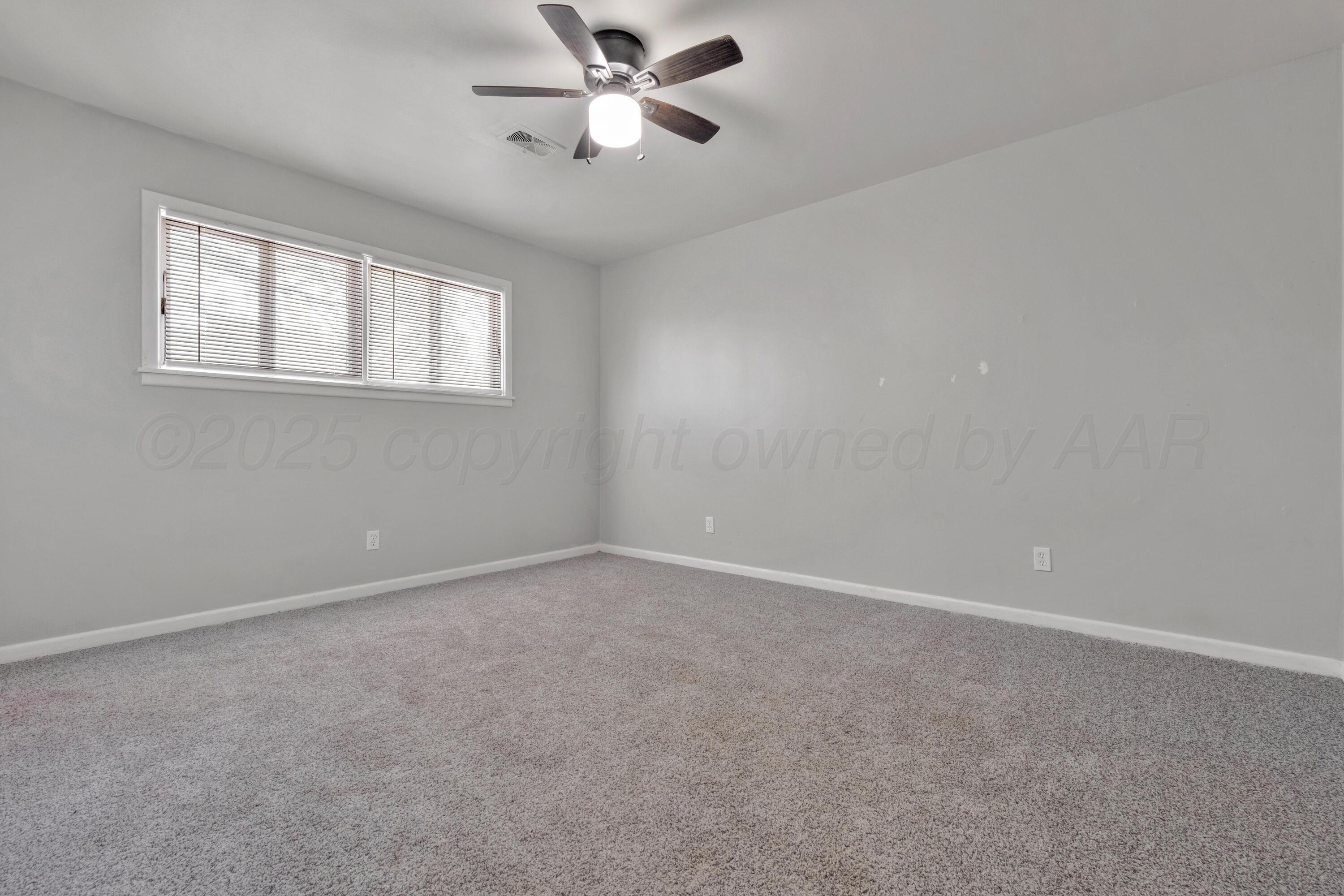 3700 Paramount Boulevard Amarillo, TX 79109 - Photo 26 of 40 a view of an empty room with a window