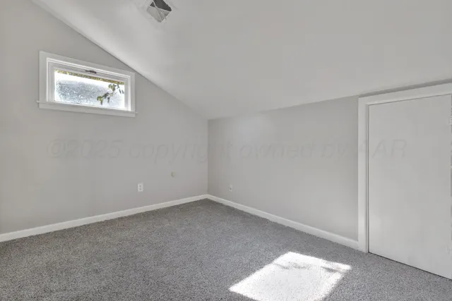 a view of kitchen with white cabinets