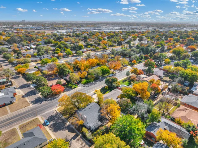 a aerial view of a house with a yard