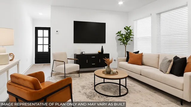 a living room with furniture a flat screen tv and a large window