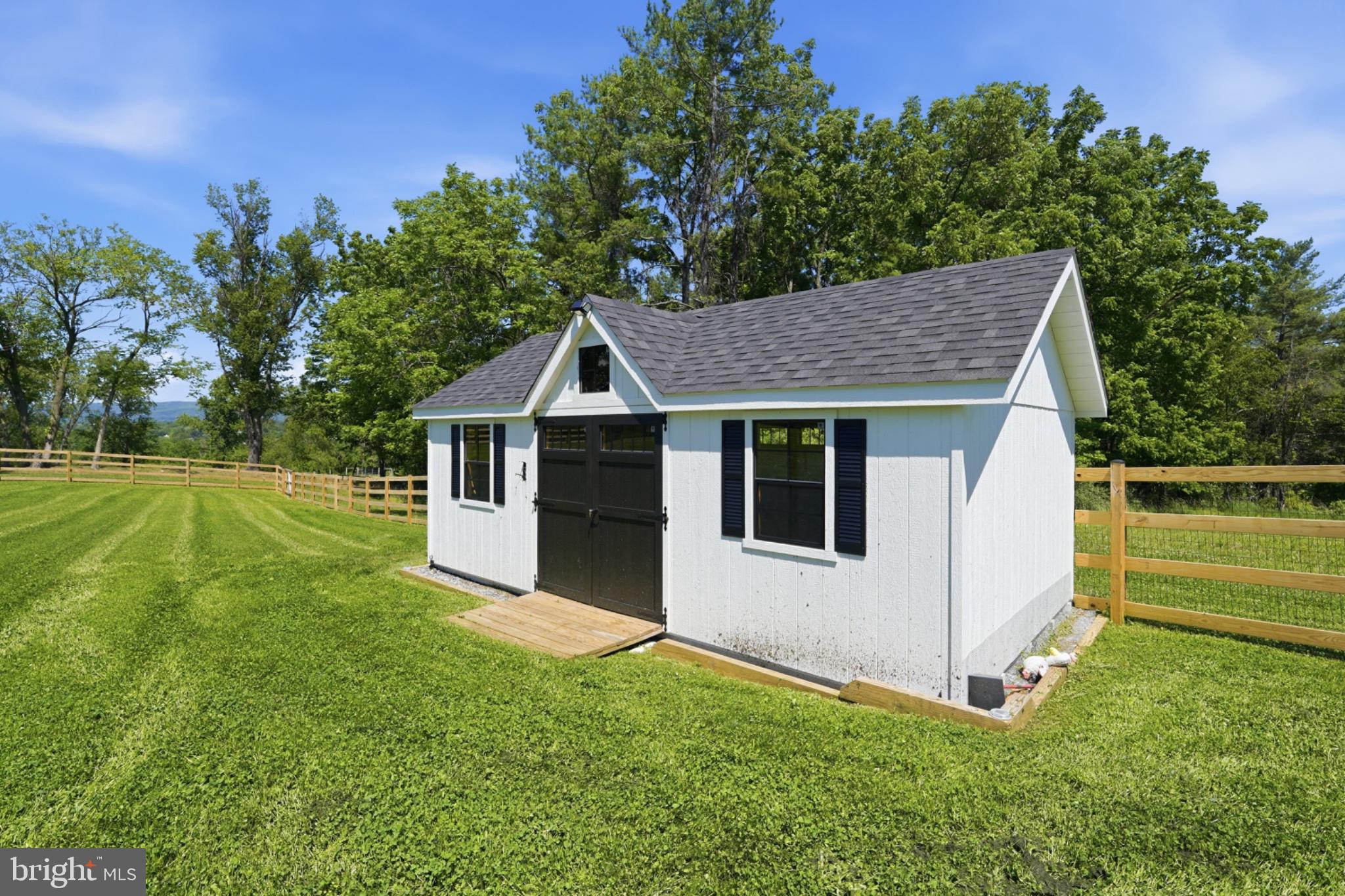 2802 Bidle Road Middletown, MD 21769 - Photo 61 of 63 Charming shed in a lush green setting.