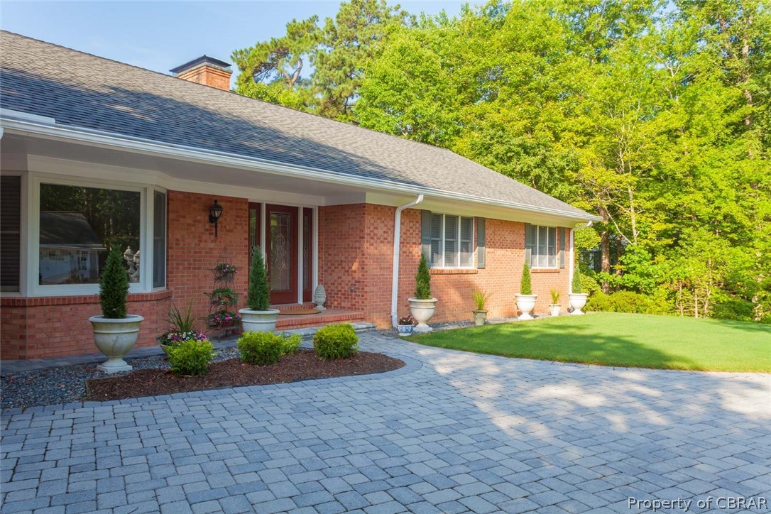 193 Peake Road Weems, VA 22576 - Photo 16 of 50 Paver Patio Leading to the Home