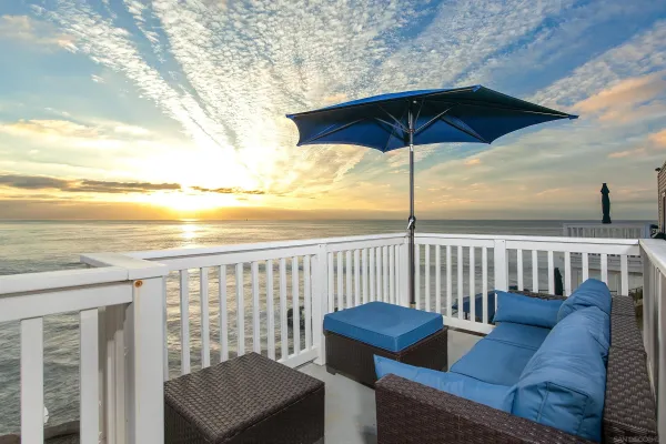 a view of a balcony with furniture