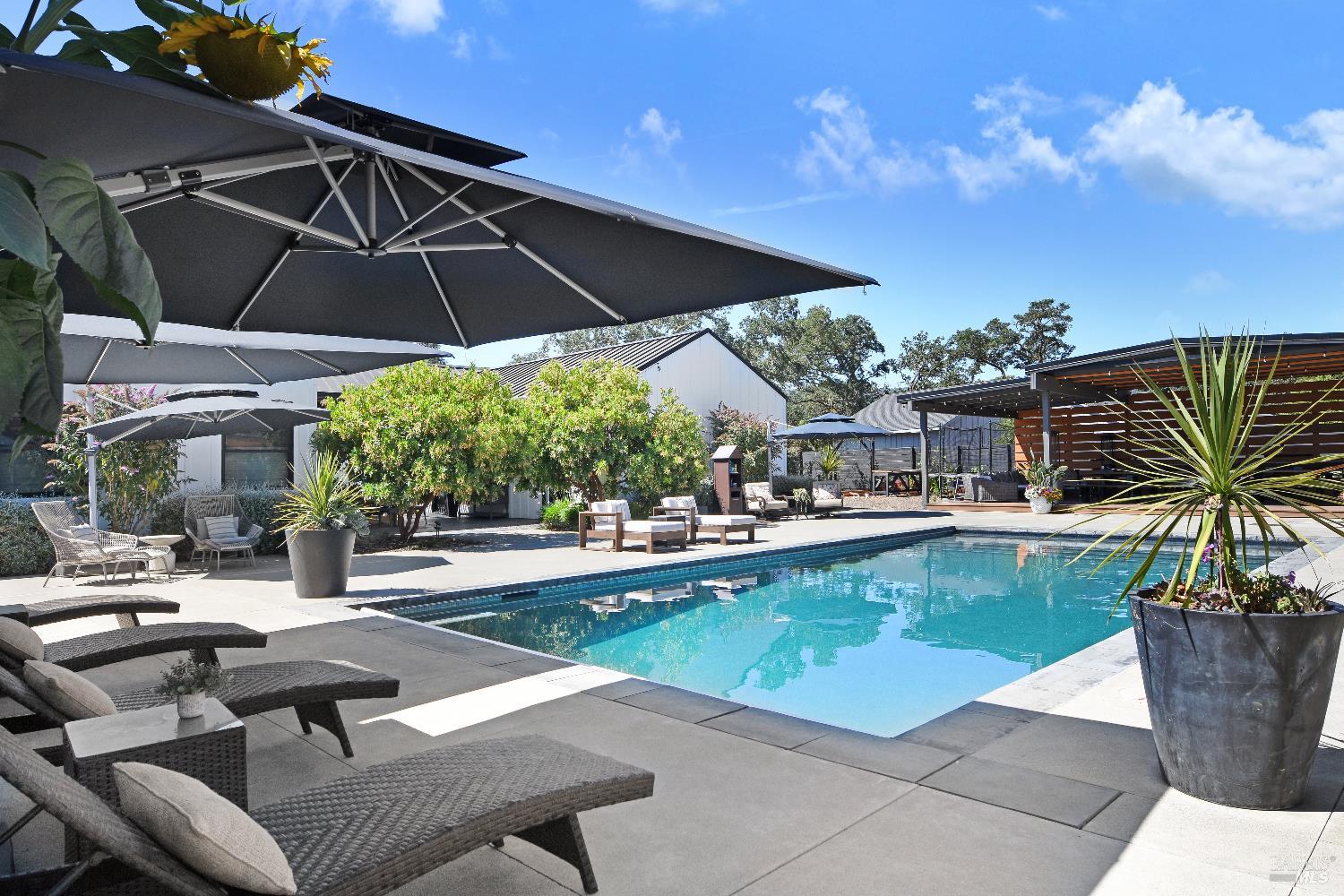 85 Trinity Road Glen Ellen, CA 95442 - Photo 3 of 62 a view of a swimming pool with a patio
