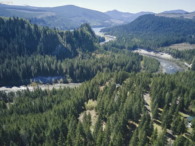 a view of a lush green hillside and a building