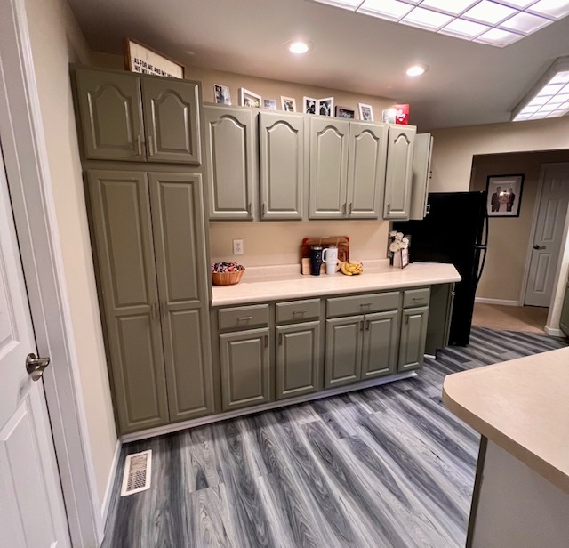 409 East Congress Avenue Rantoul, IL 61866 - Photo 7 of 20 a kitchen with a sink a refrigerator and cabinets