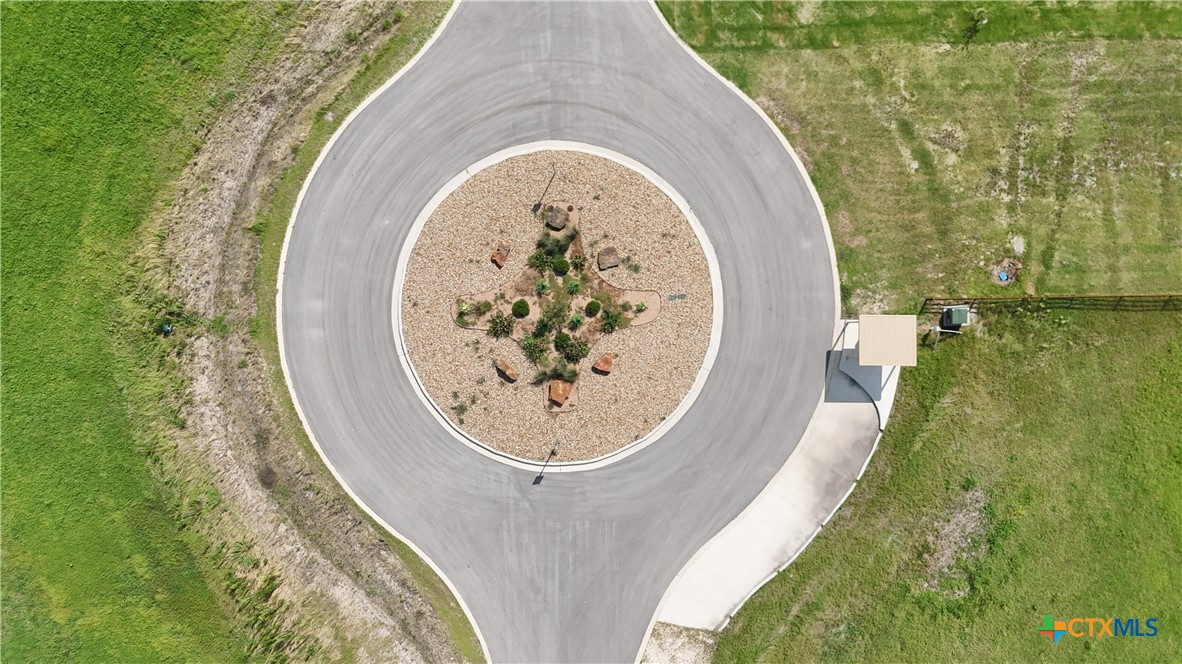 Tbd Tbd Cougar Lane Lott, TX 76656 - Photo 3 of 9 an aerial view of a house with outdoor space and a lake view