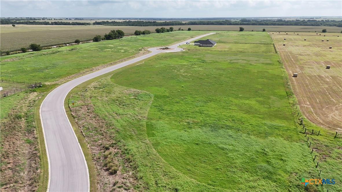 Tbd Tbd Cougar Lane Lott, TX 76656 - Photo 7 of 9 a view of a swimming pool with a garden and seating area