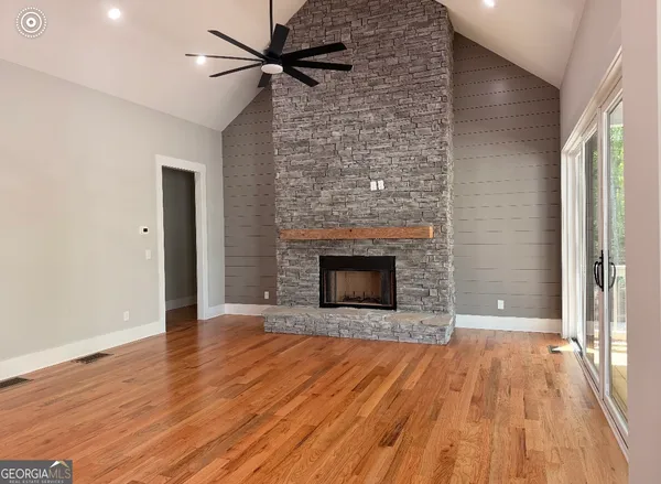 a bathroom with a sink toilet vanity and shower