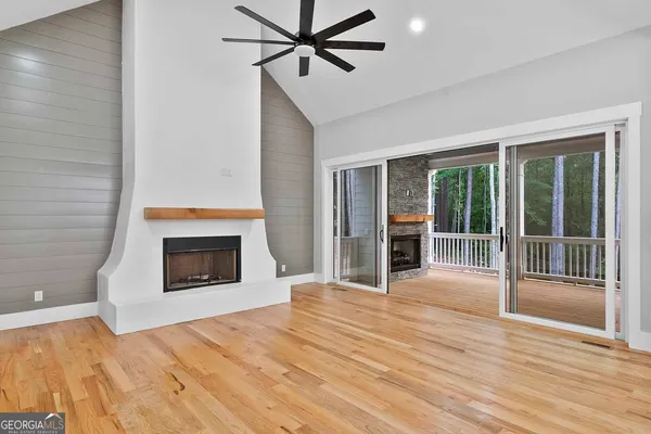 a front view of a house with a garden and yard