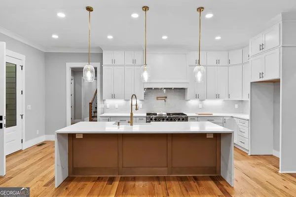 a front view of a house with a garden and yard