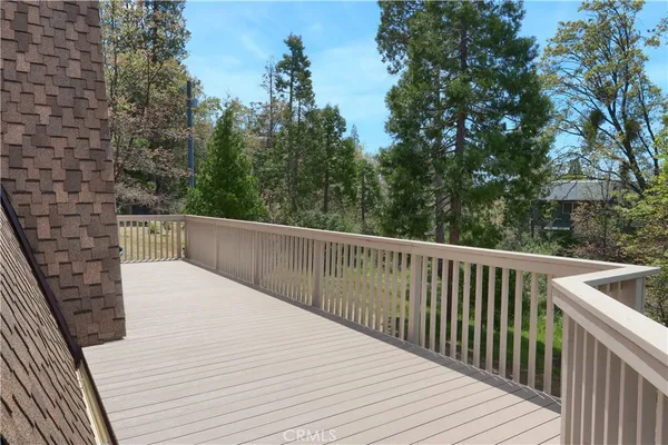 a view of a two chairs in the balcony