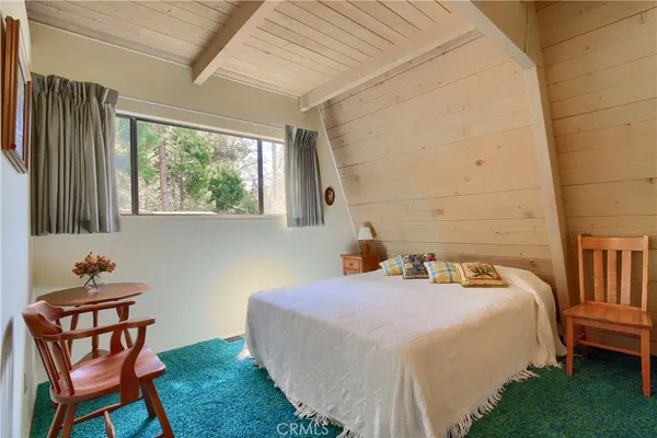 a bedroom with a bed and a closet