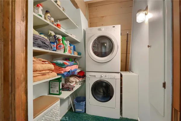 a bedroom with a bed and a closet