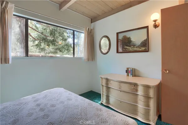 a bathroom with double sink and a mirror