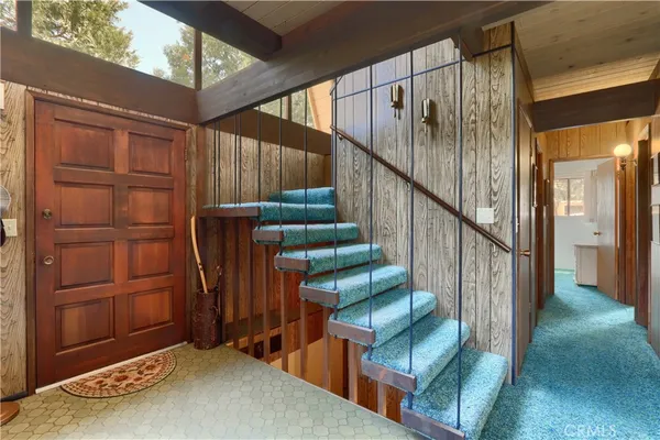 a view of staircase with wooden floor and stairs