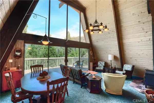 a dining room with furniture mountain view and a potted plant