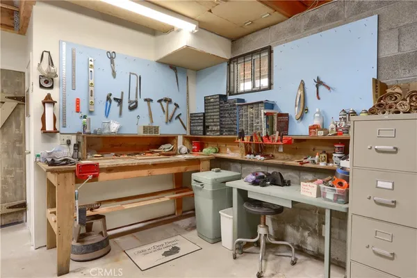 a view of a grassy field with trees around