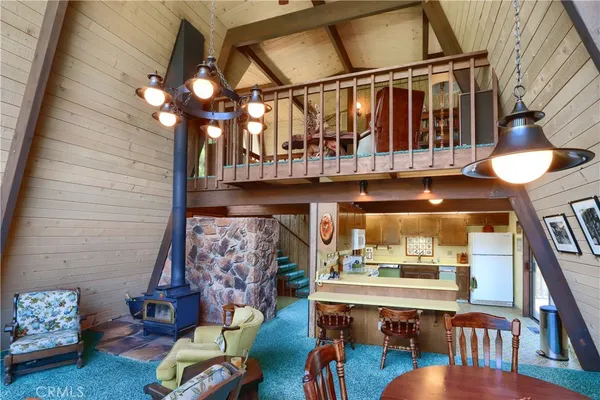 a view of dinning room with furniture and chandelier
