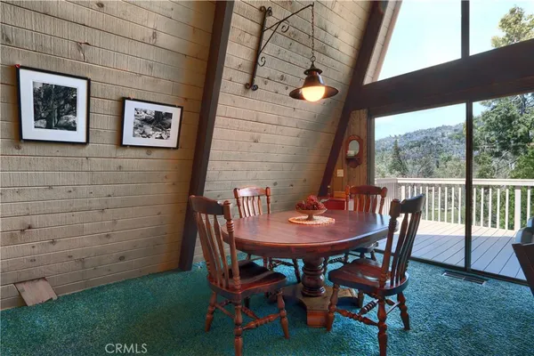 a view of a patio with table and chairs