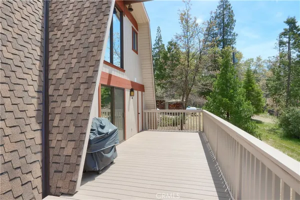 a view of a balcony with chairs