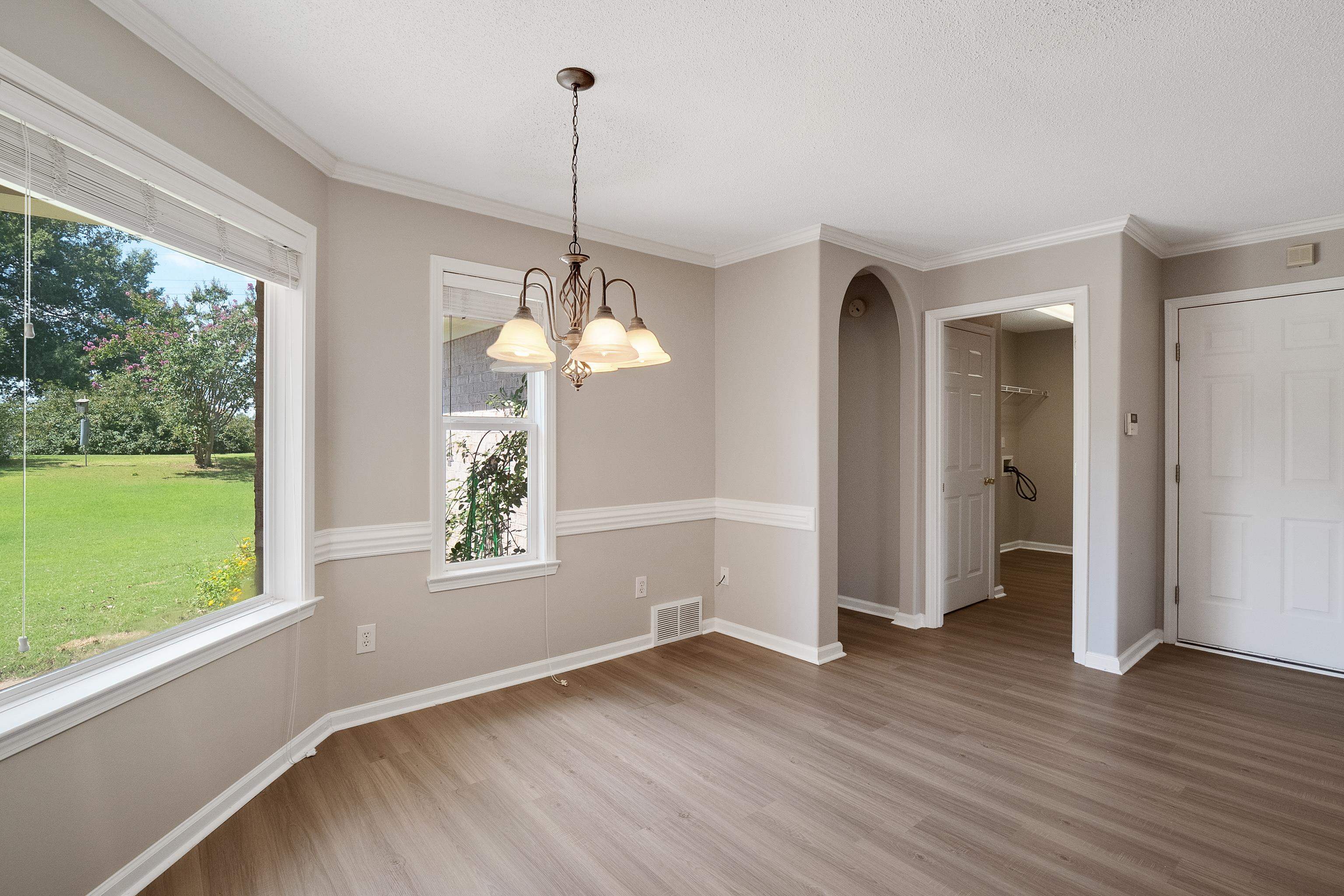 1171 Macon Hall Road Cordova, TN 38018 - Photo 13 of 35 a view of empty room with wooden floor and fan