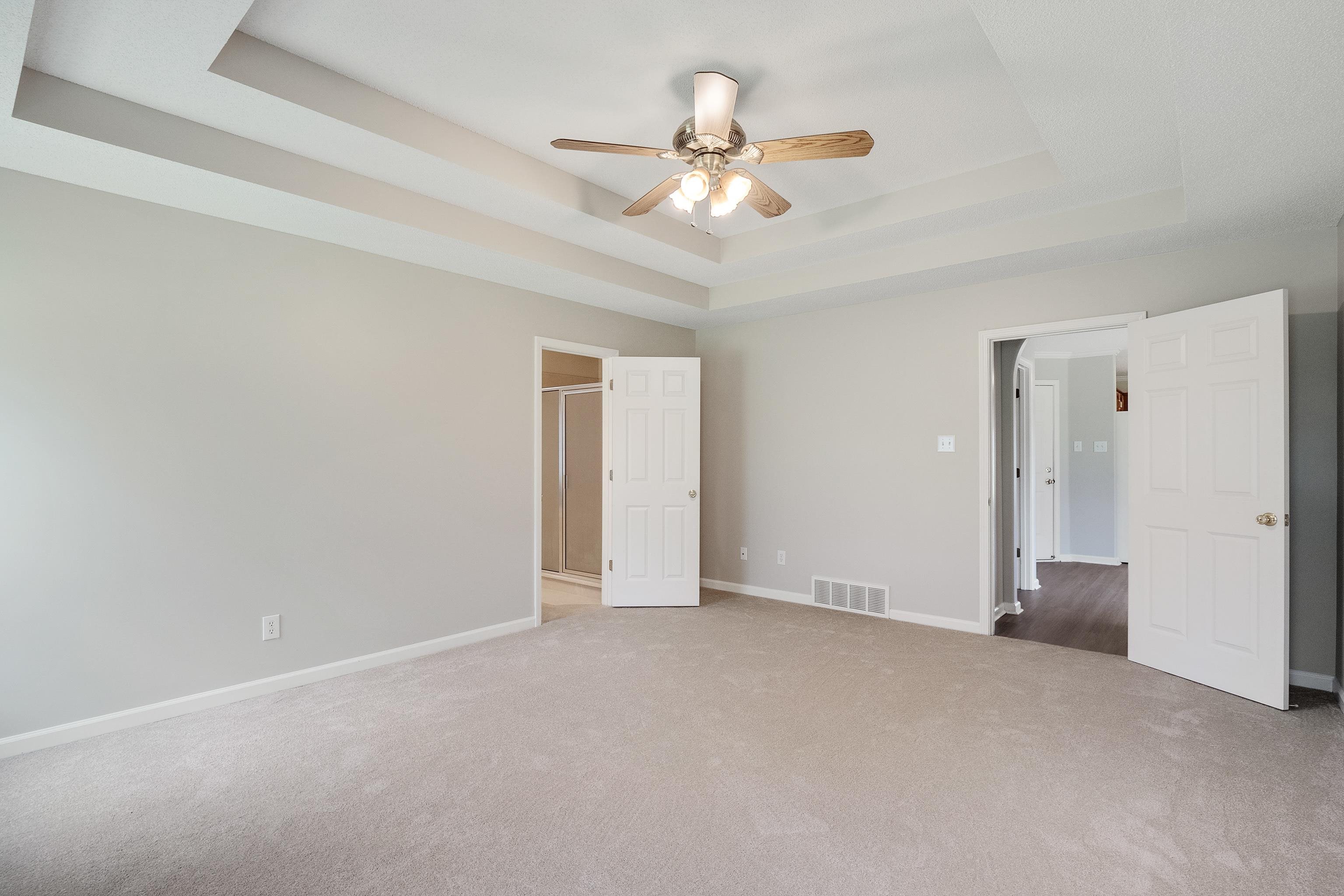 1171 Macon Hall Road Cordova, TN 38018 - Photo 16 of 35 a view of an empty room with a ceiling fan