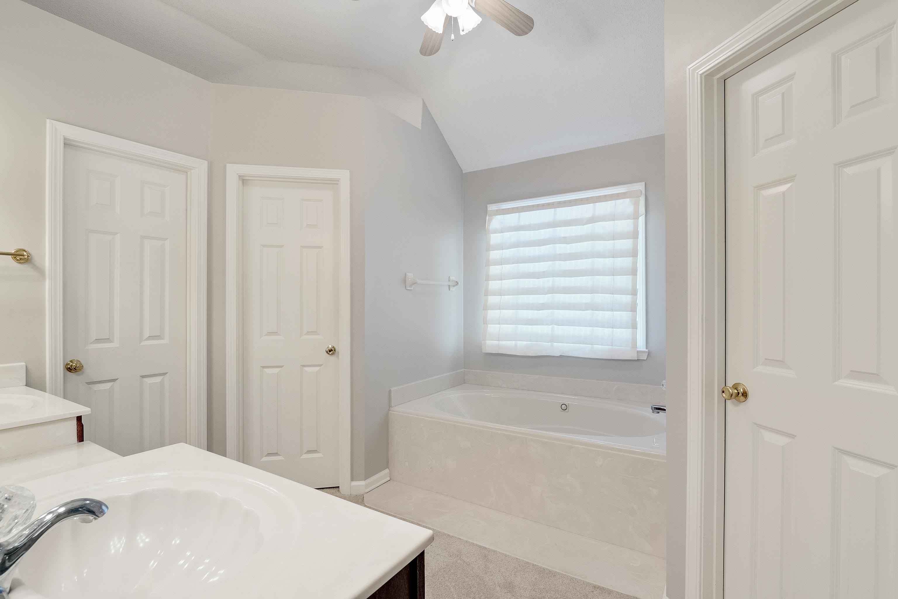 1171 Macon Hall Road Cordova, TN 38018 - Photo 17 of 35 a bathroom with a bathtub and a shower