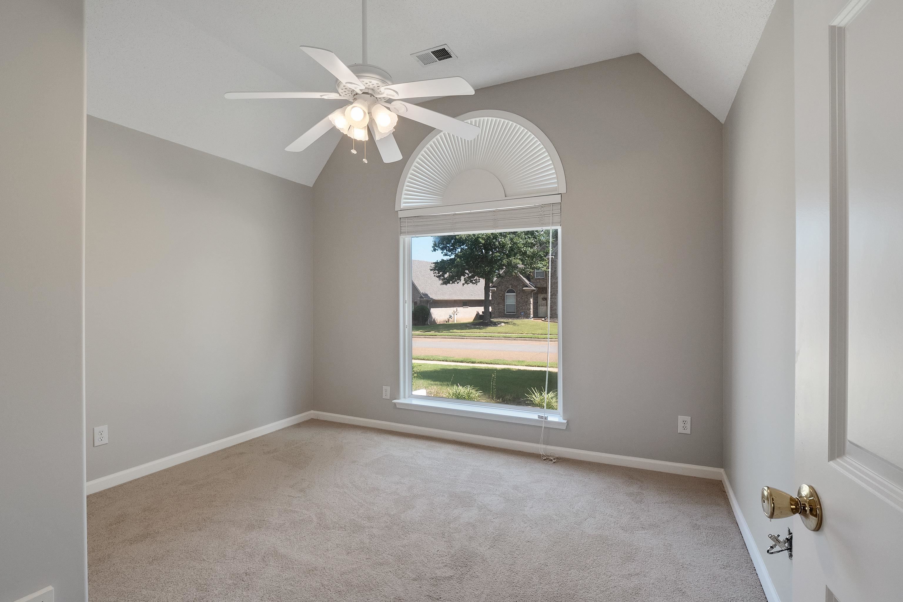 1171 Macon Hall Road Cordova, TN 38018 - Photo 20 of 35 an empty room with windows and fan