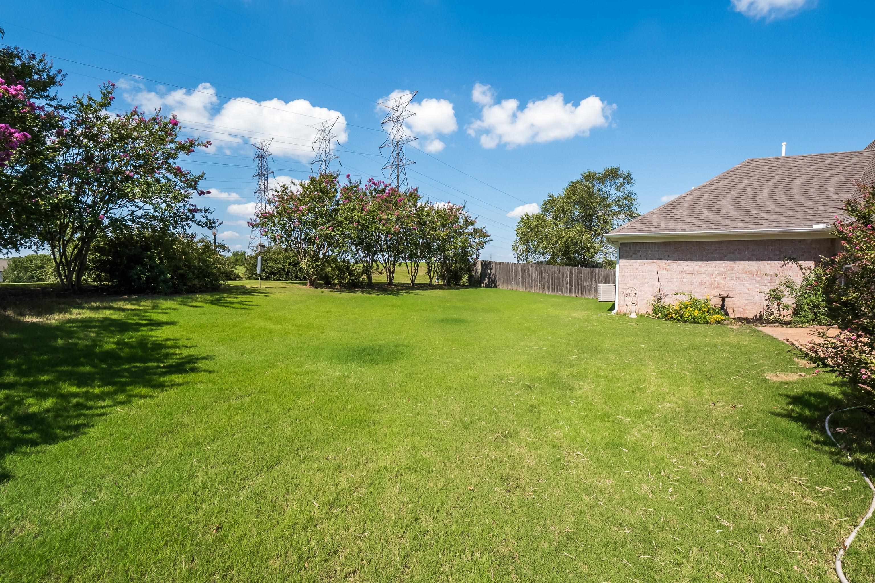 1171 Macon Hall Road Cordova, TN 38018 - Photo 32 of 35 a view of a house with a big yard