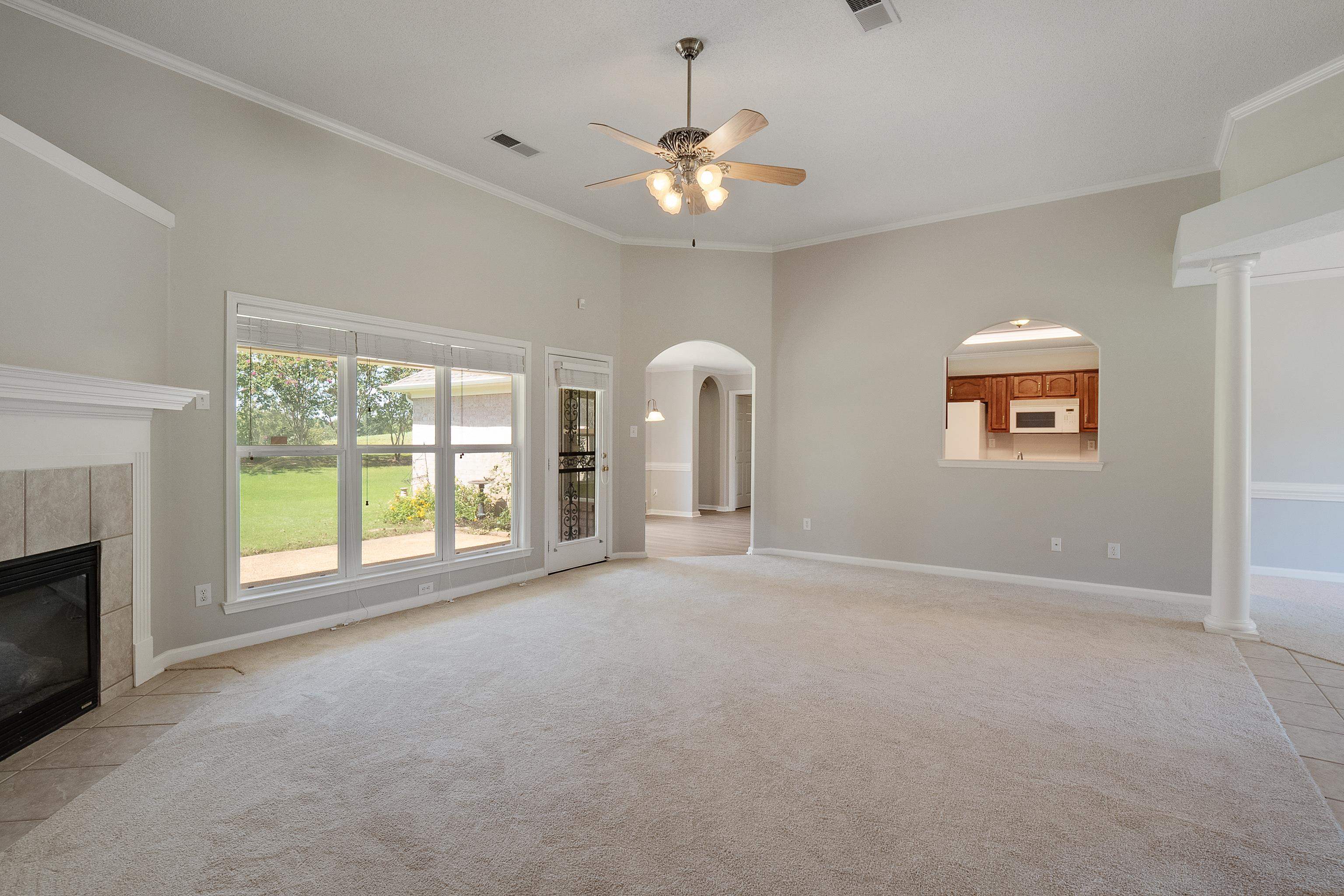 1171 Macon Hall Road Cordova, TN 38018 - Photo 8 of 35 a view of an empty room with a window