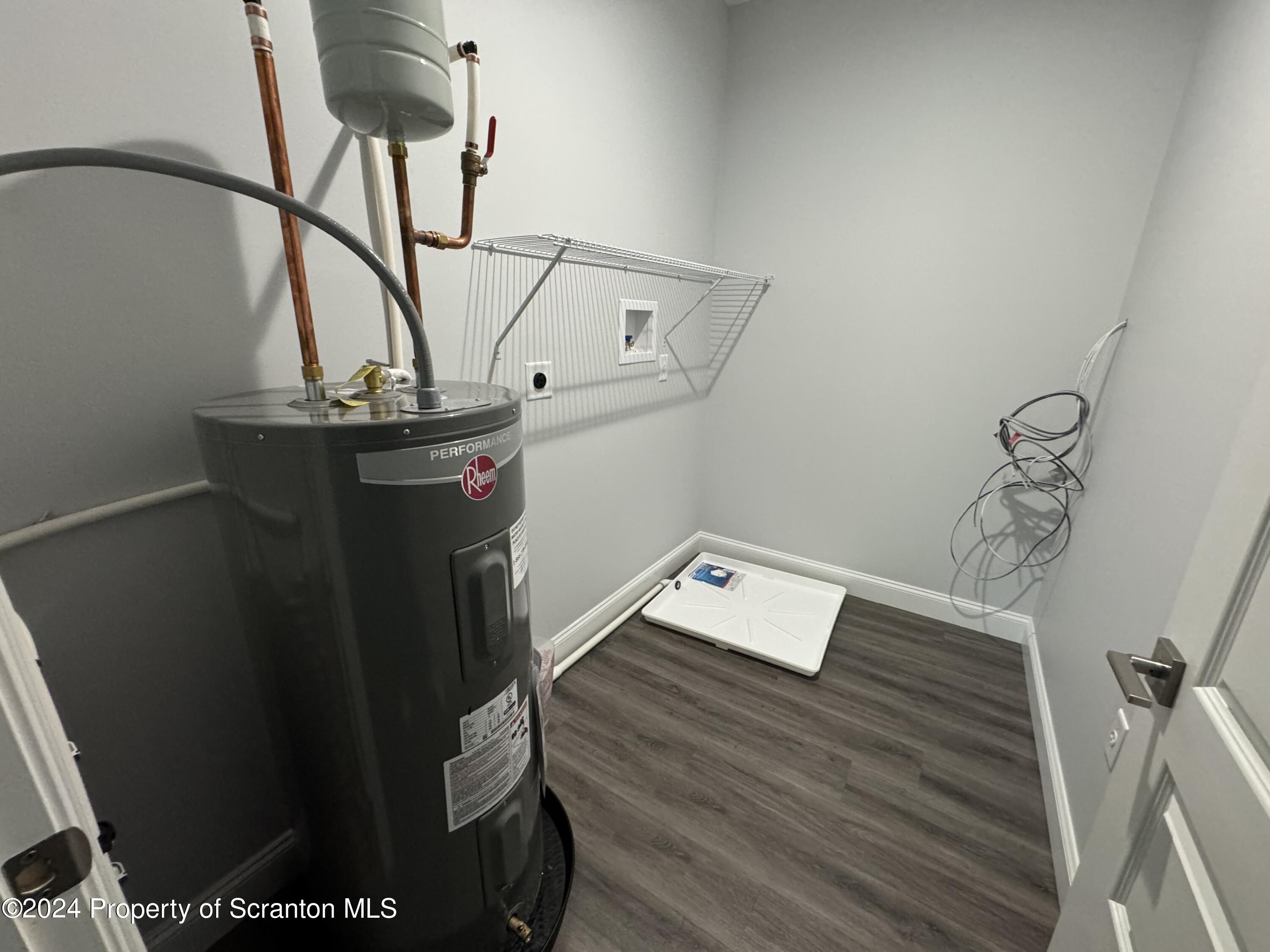 104 Circle Drive Taylor, PA 18517 - Photo 11 of 31 a view of a room with rack and wooden floor