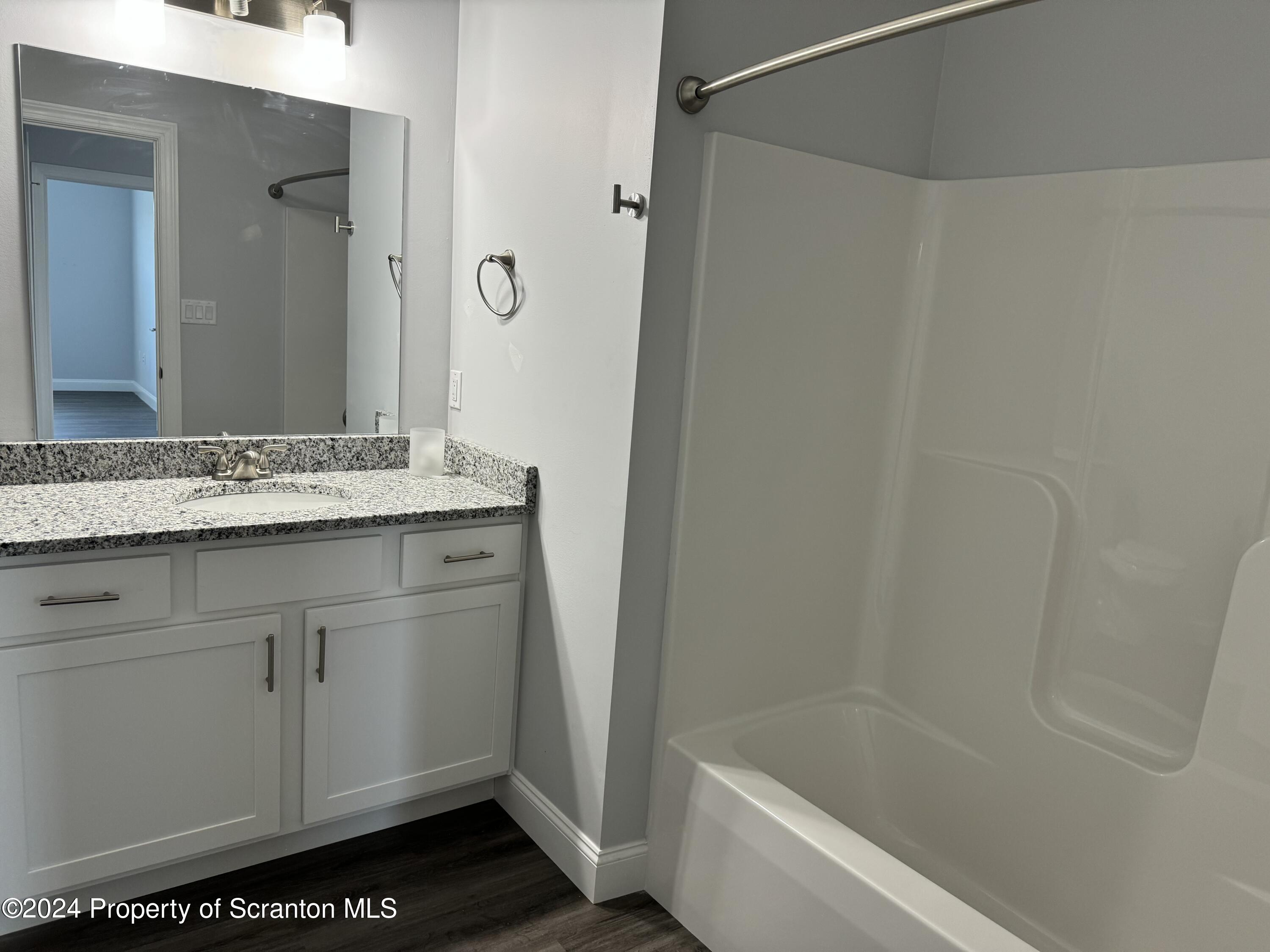 104 Circle Drive Taylor, PA 18517 - Photo 13 of 31 a bathroom with a sink and a bathtub