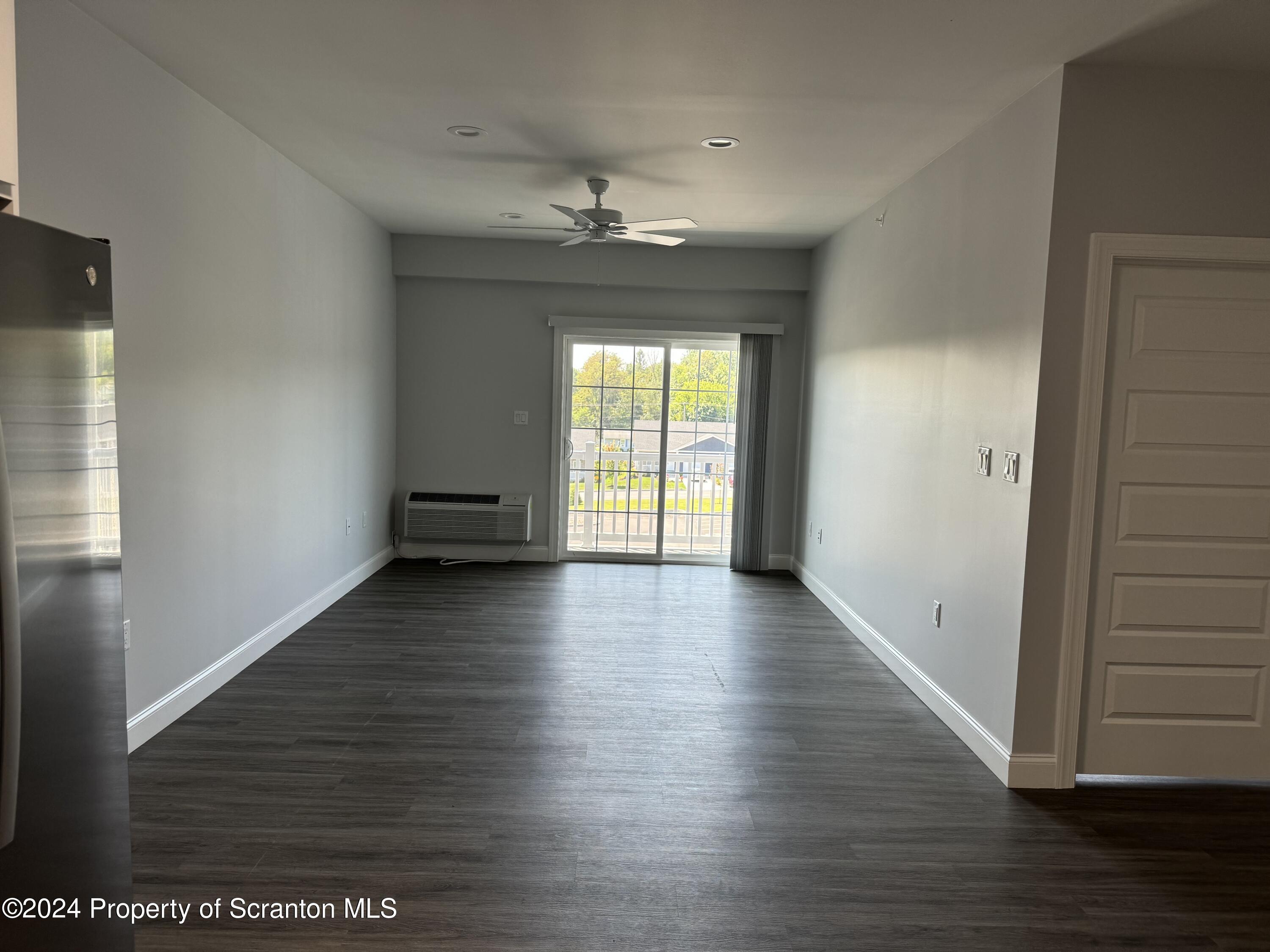 104 Circle Drive Taylor, PA 18517 - Photo 16 of 31 wooden floor in an empty room with a window