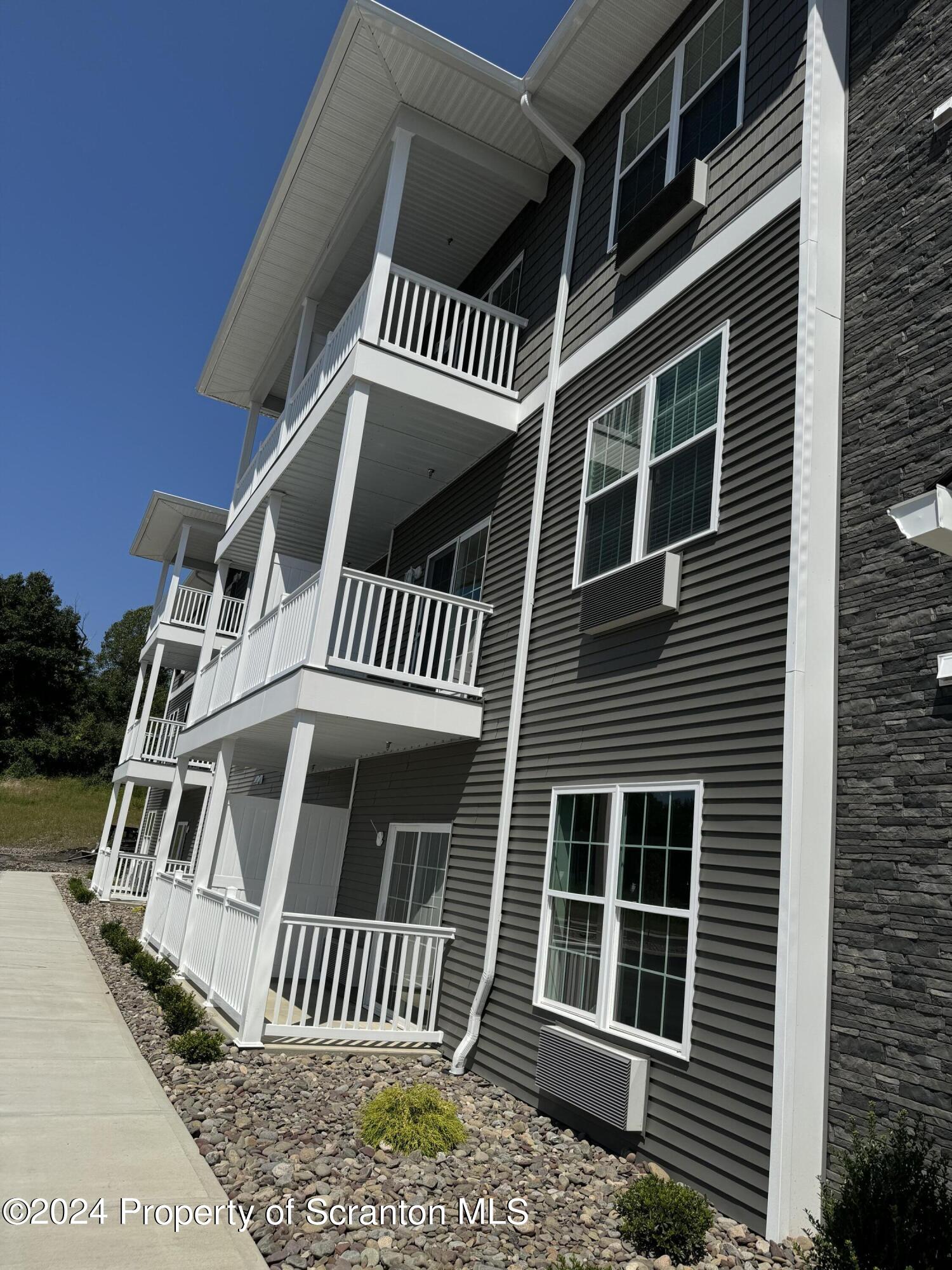 104 Circle Drive Taylor, PA 18517 - Photo 2 of 31 a view of a house with a deck