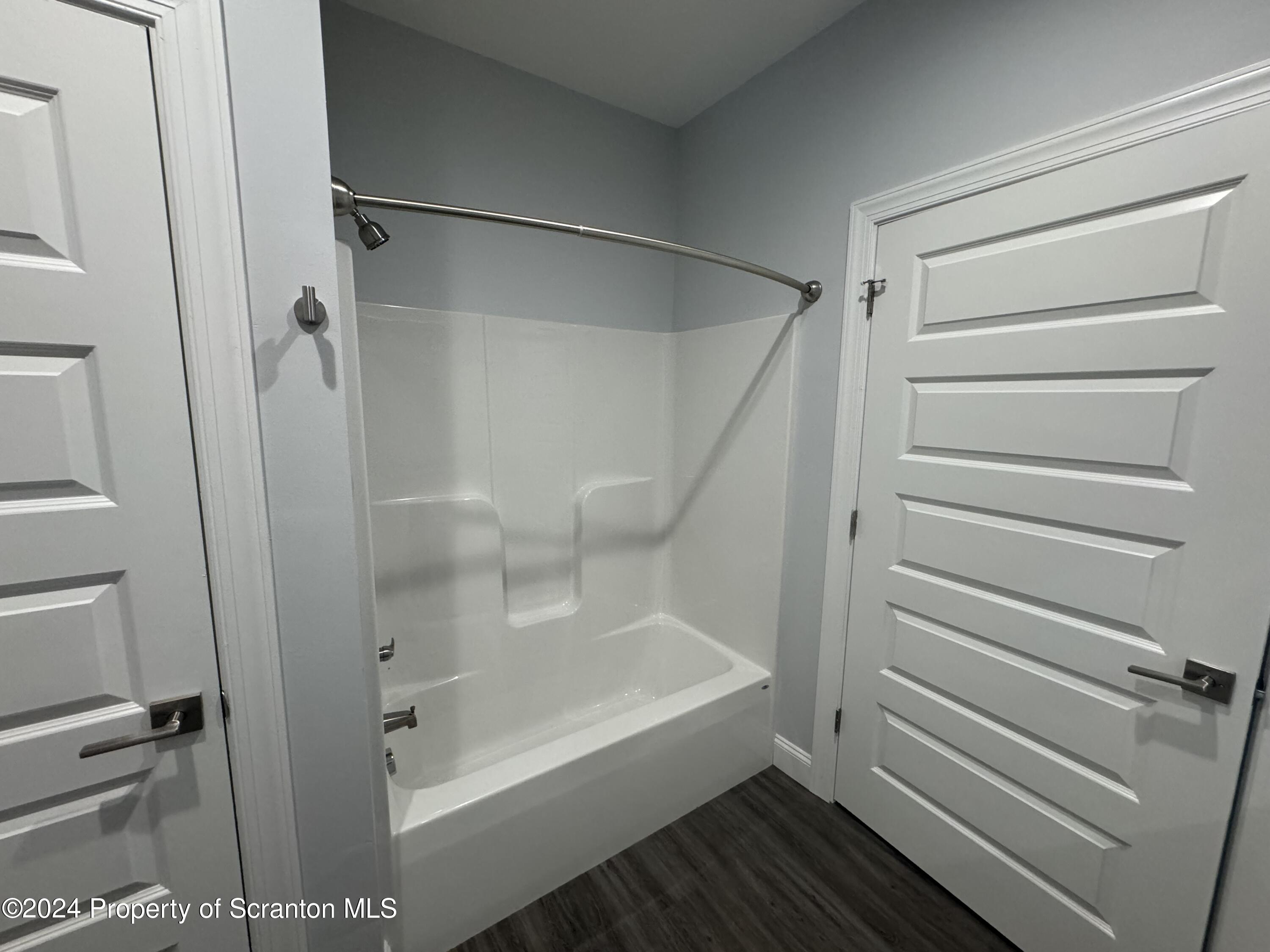 104 Circle Drive Taylor, PA 18517 - Photo 29 of 31 a bathroom with a bathtub and a shower