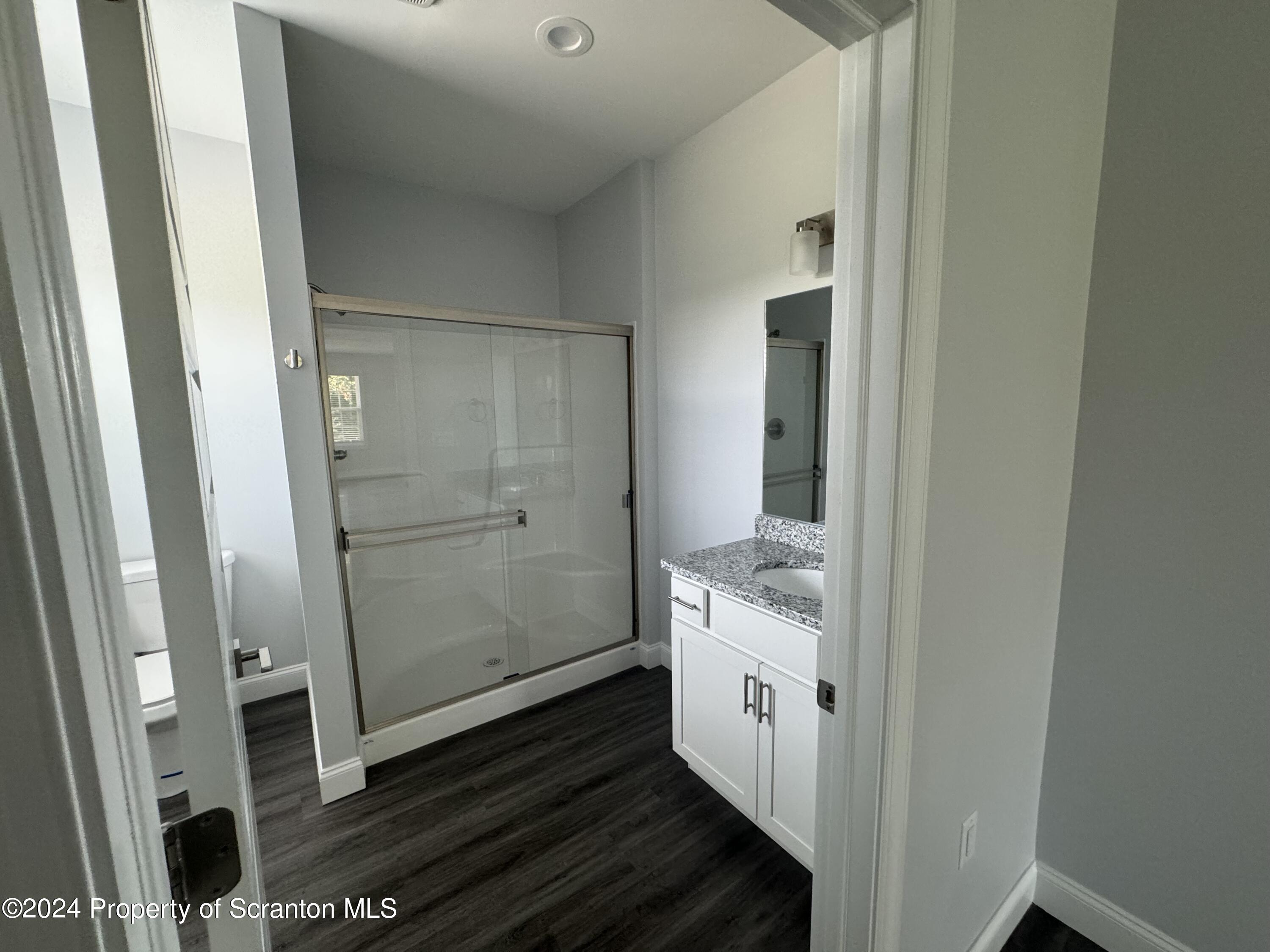 104 Circle Drive Taylor, PA 18517 - Photo 31 of 31 a bathroom with a shower and a sink