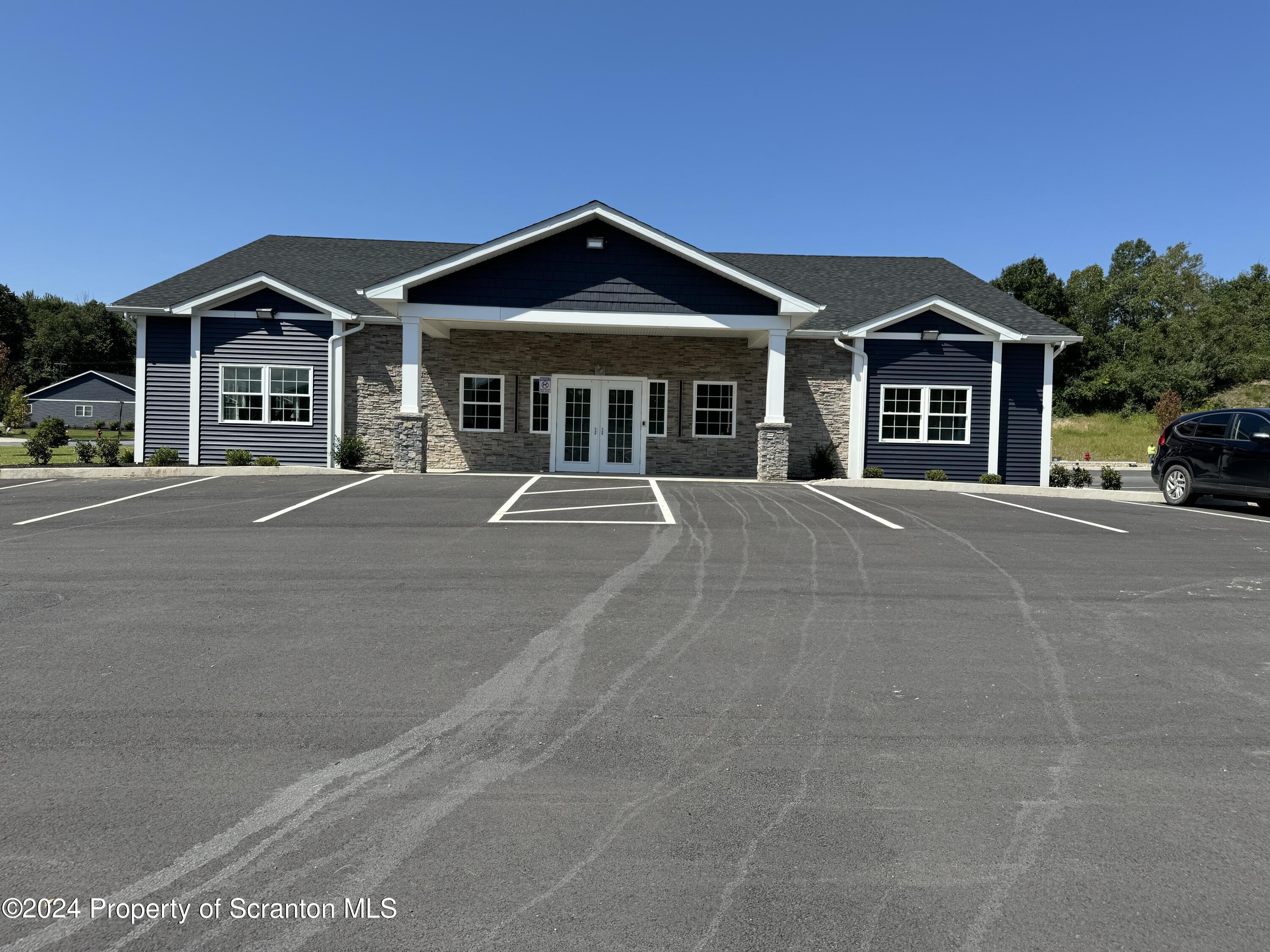 104 Circle Drive Taylor, PA 18517 - Photo 9 of 31 a front view of a house with a yard