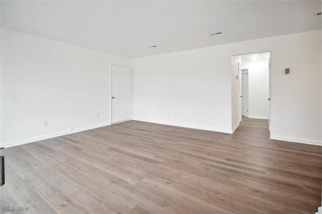 8796 West Ridgewood Drive Cleveland, OH 44130 - Photo 8 of 38 Empty room featuring hardwood / wood-style flooring