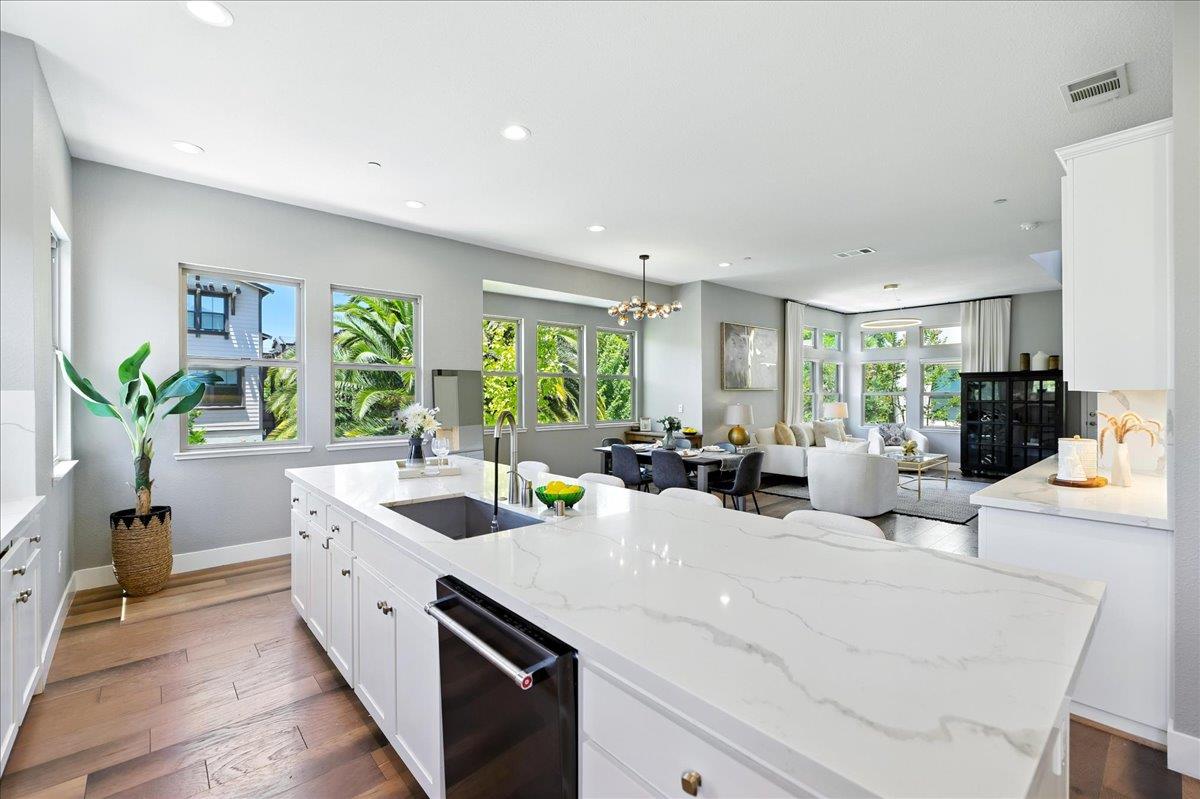 324 Cherokee Loop Mountain View, CA 94043 - Photo 17 of 62 a view of a kitchen counter top space with sink a window and wooden floor