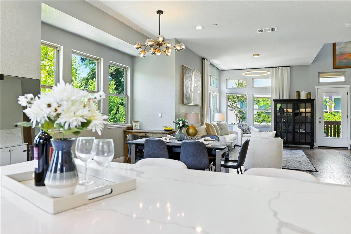 324 Cherokee Loop Mountain View, CA 94043 - Photo 19 of 62 a dining room with furniture a large window and chandelier