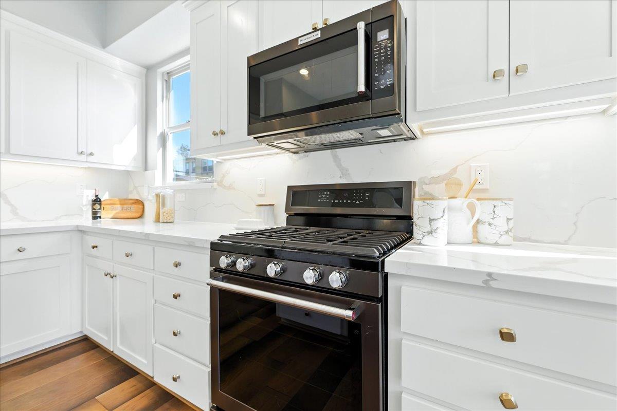 324 Cherokee Loop Mountain View, CA 94043 - Photo 21 of 62 a kitchen with stainless steel appliances a stove a microwave and cabinets