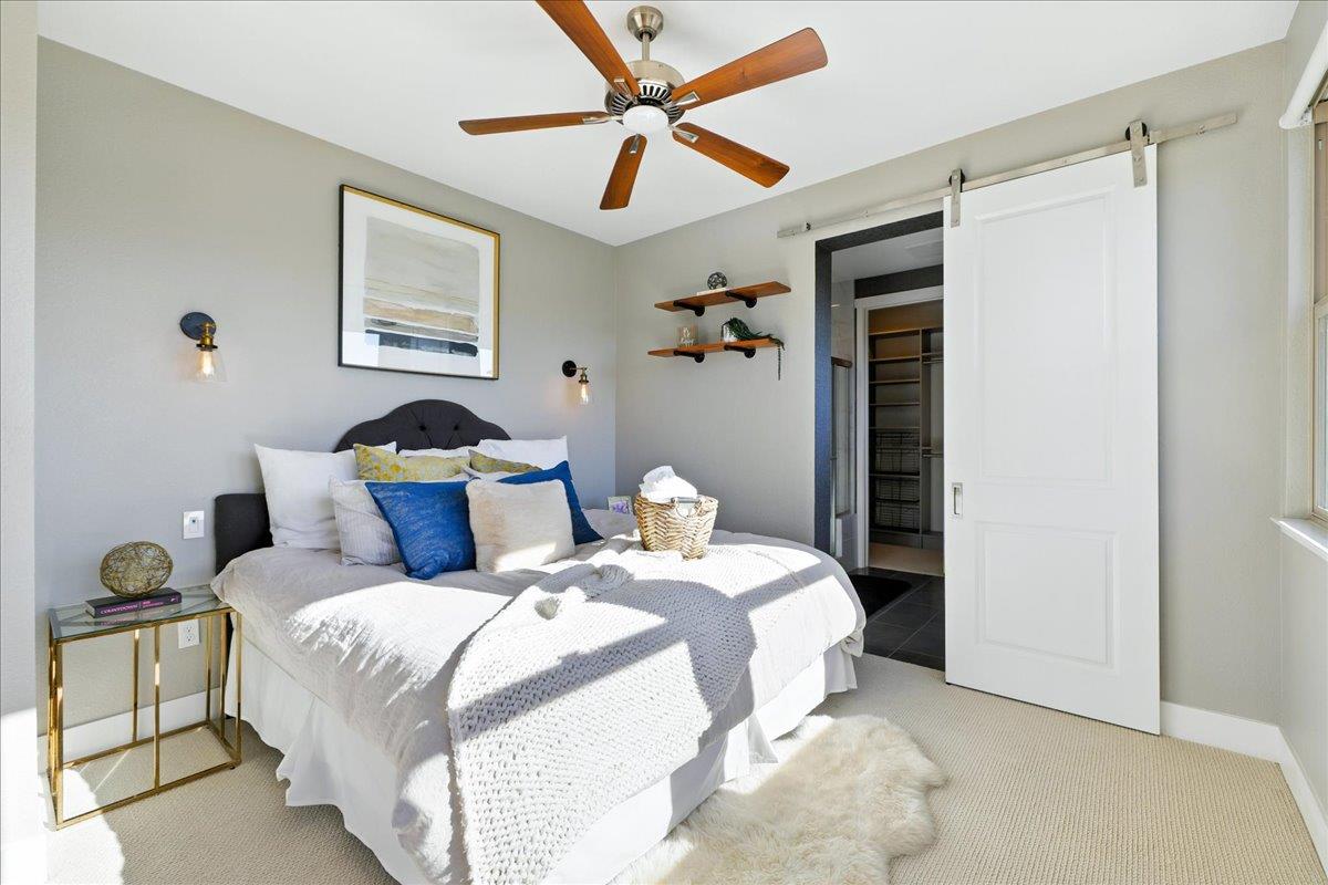 324 Cherokee Loop Mountain View, CA 94043 - Photo 29 of 62 a bedroom with bed and a chandelier