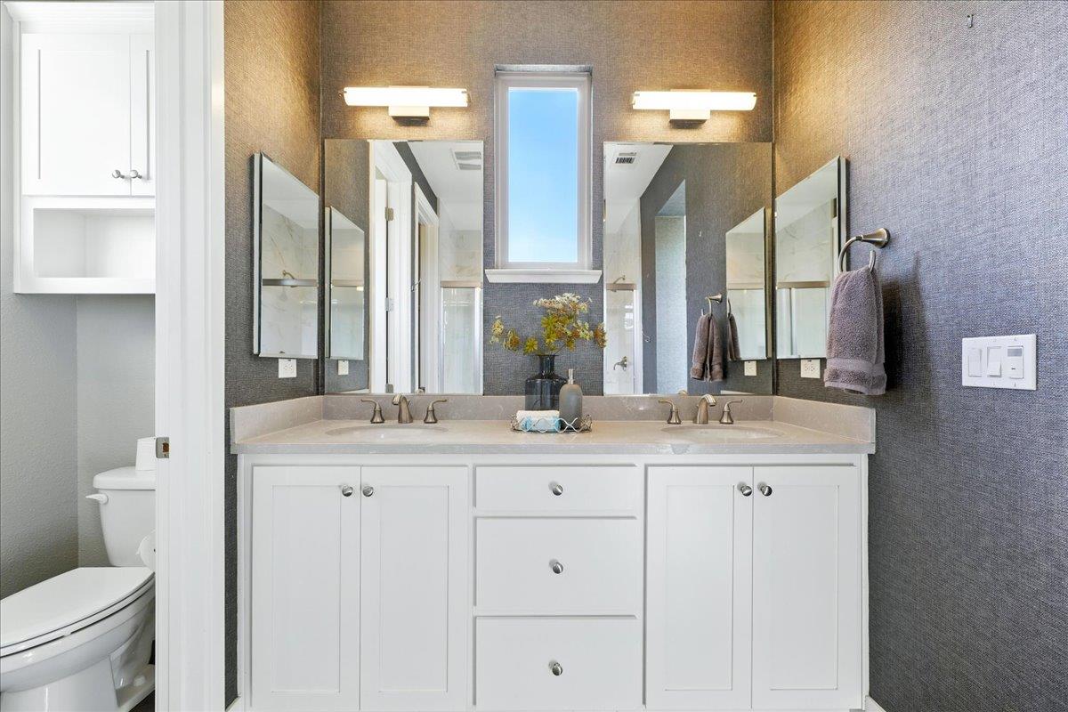 324 Cherokee Loop Mountain View, CA 94043 - Photo 33 of 62 a bathroom with double sink and a mirror